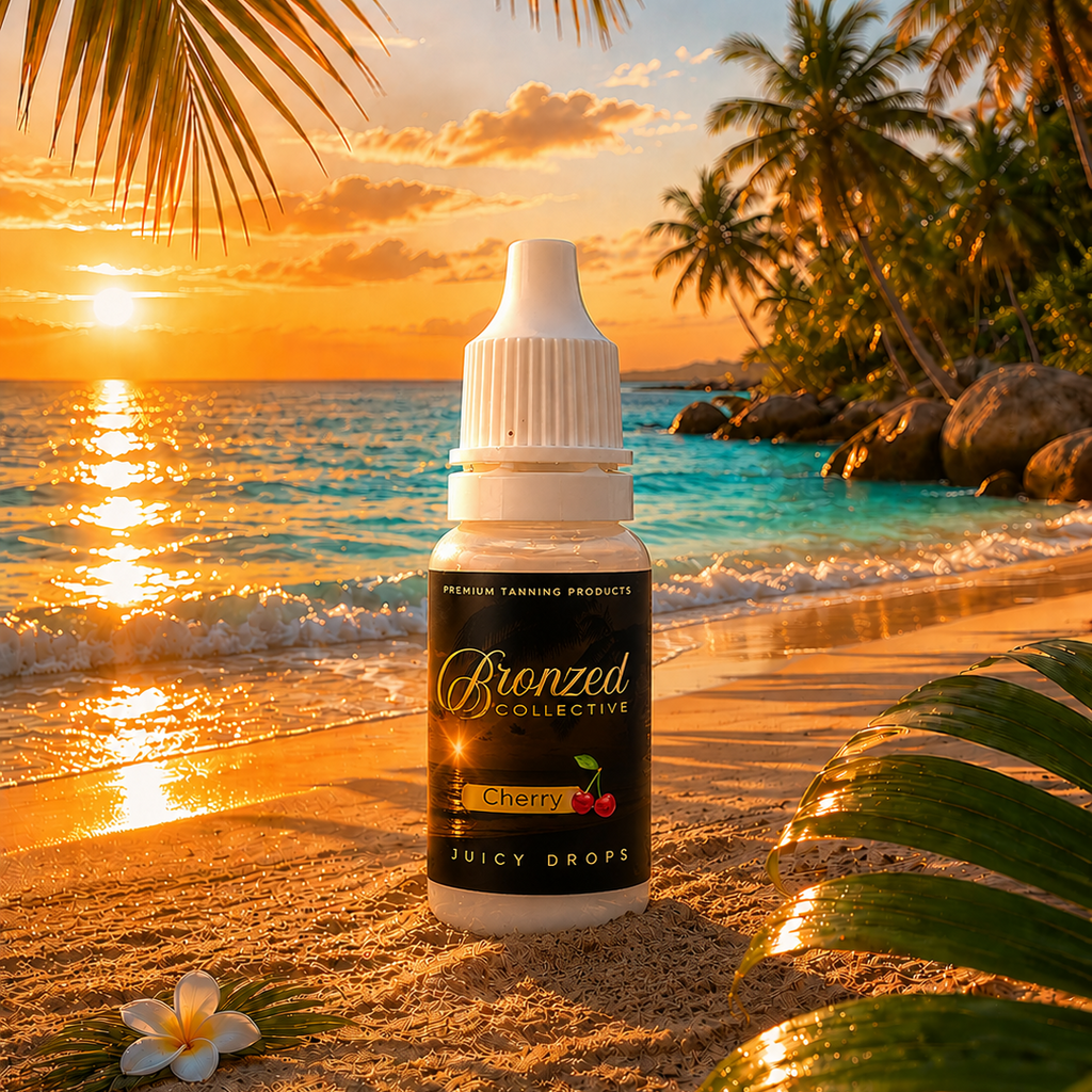 Bronzed Collective Cherry Juicy Drops bottle on a beach with sunset and palm trees in the background